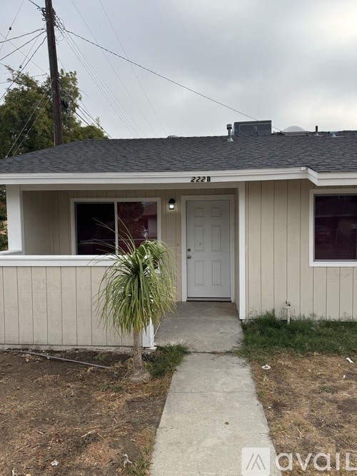 A house with the number 2228 on the roof.