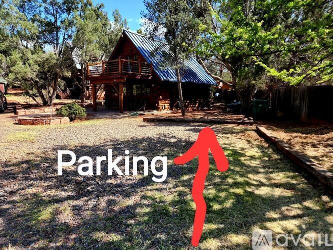 A red arrow points to the word "Parking" in a grassy area.