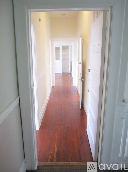 A staircase leading to a door with a glass window.