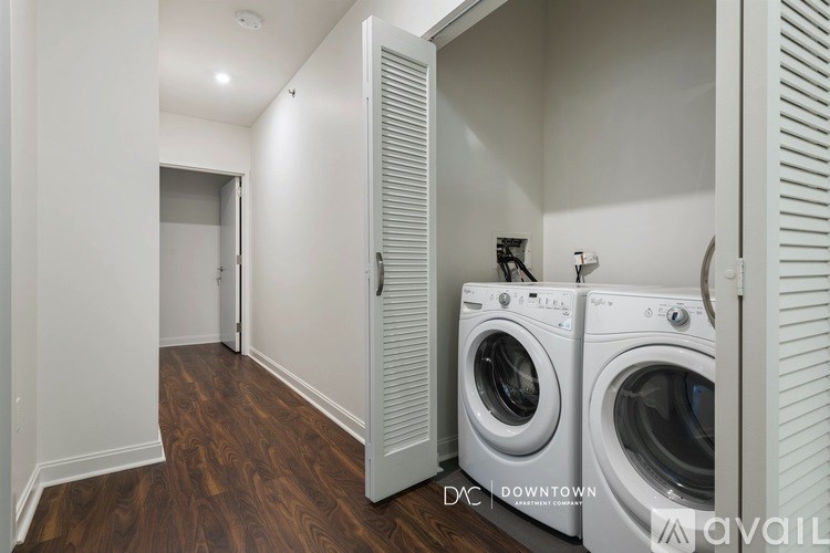 A laundry room with a washer and dryer in it.