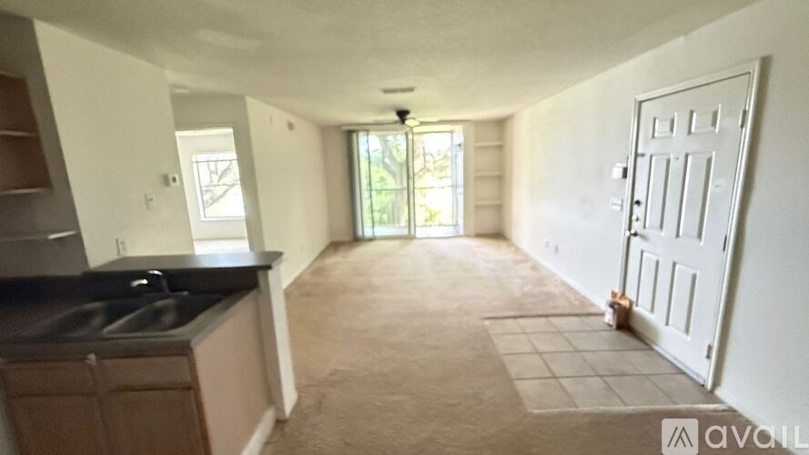 A kitchen with a sink and a window.