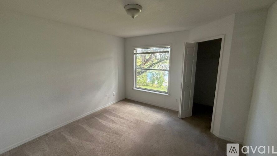 A room with a window and a door.