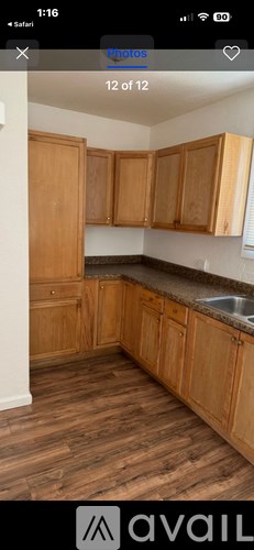 A kitchen with wooden cabinets and a countertop.
