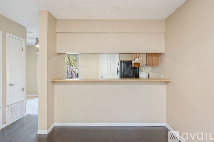 A kitchen area with a counter and a window.