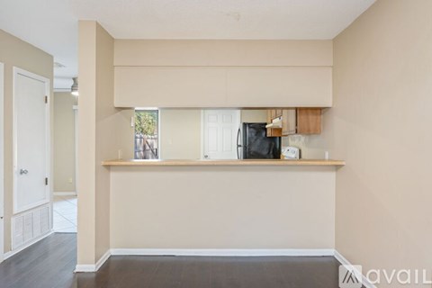A kitchen area with a counter and a window.