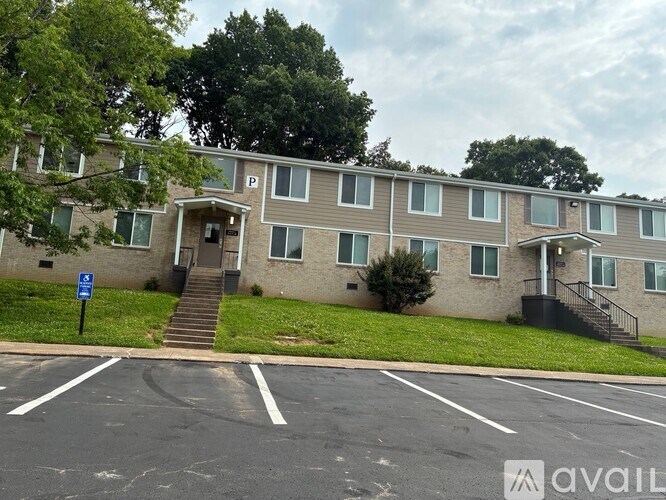 A building with a parking lot in front of it.