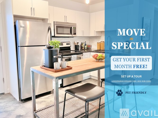 A kitchen with a refrigerator, microwave, and stove top oven.