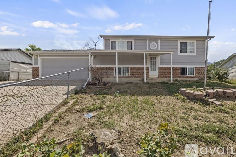 A house with a fenced backyard is for sale.
