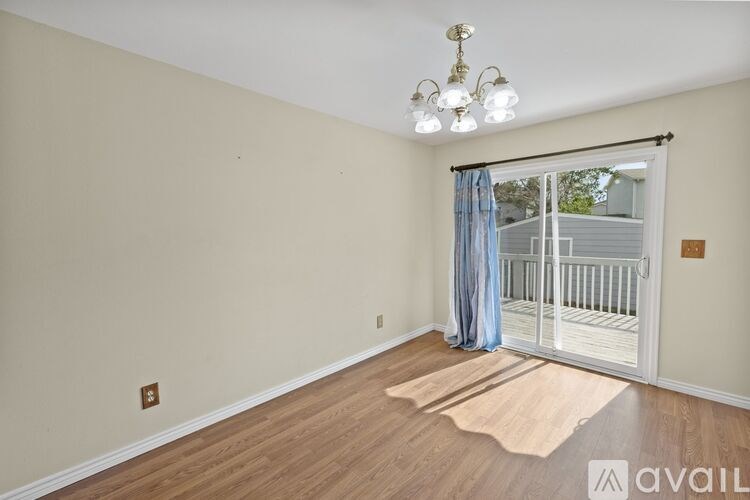 A baby's room with a crib and a chandelier.