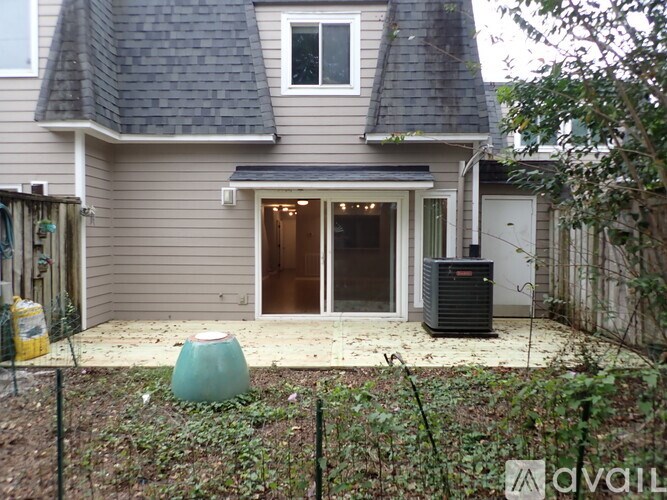 A house with a grey roof and a white door.