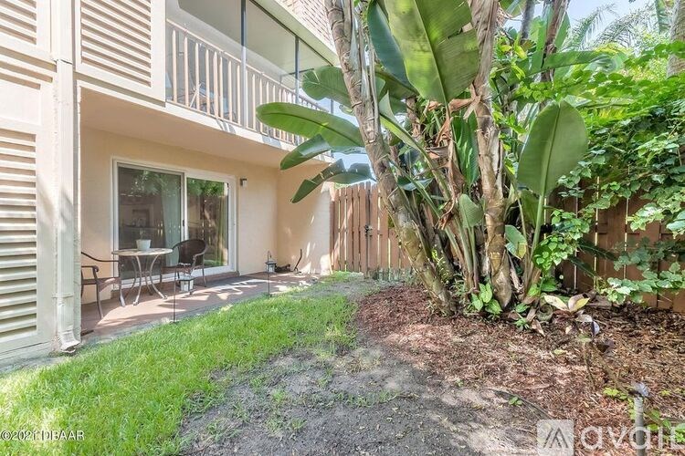 A patio area with a table and chairs is visible.