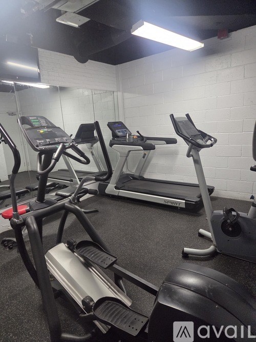 A gym with treadmills and exercise bikes.