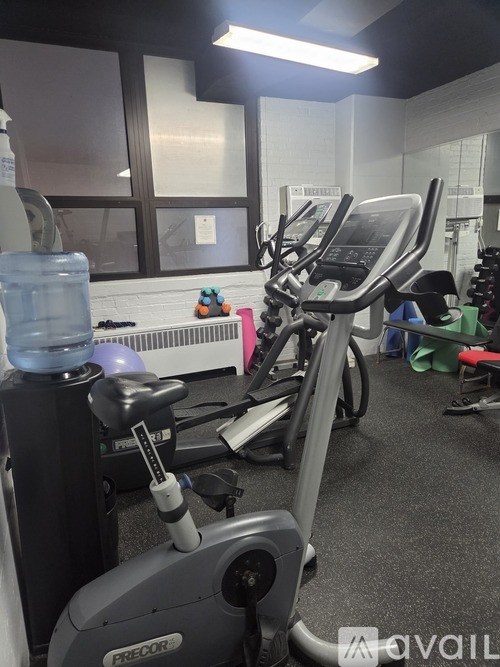 A gym with a Predator exercise bike in the foreground.