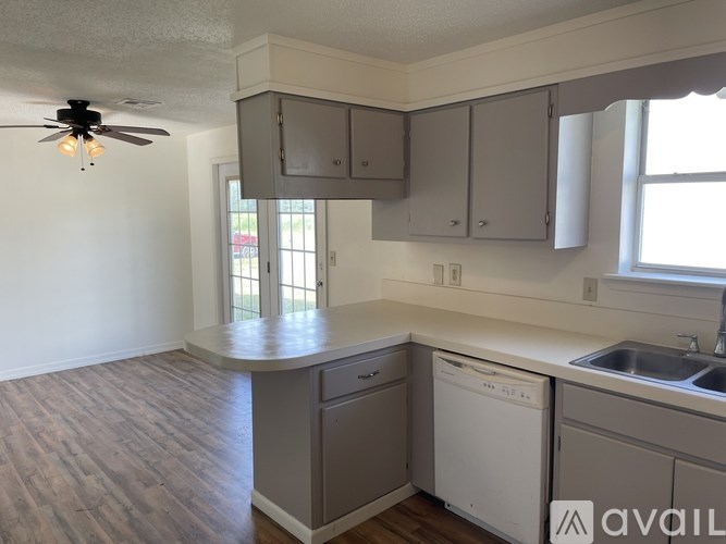 A kitchen with a dishwasher and a sink.