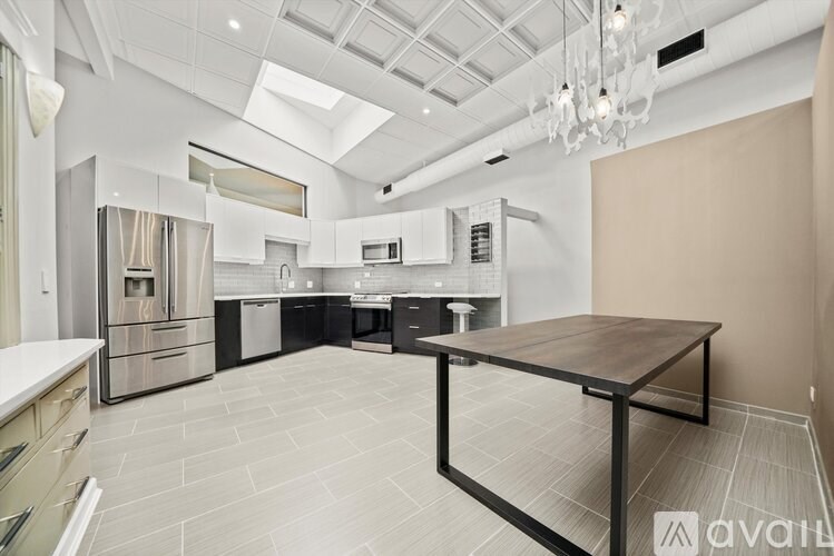 A modern kitchen with a large island in the center.