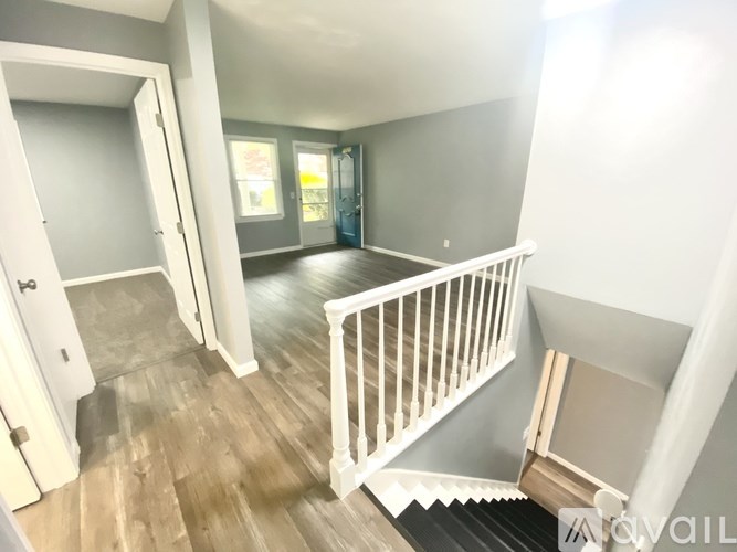 A room with a staircase leading to the second floor.