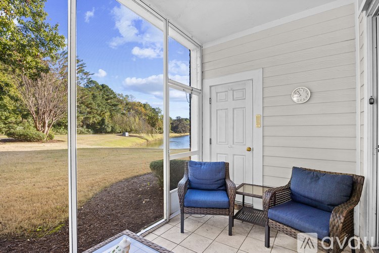 A patio with a chair and table is shown.
