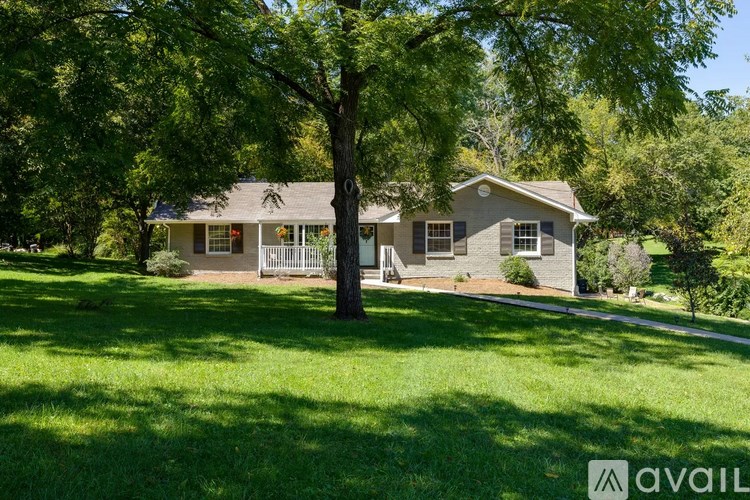 A house with a tree in front of it.