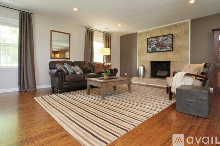 A living room with a fireplace and a couch.