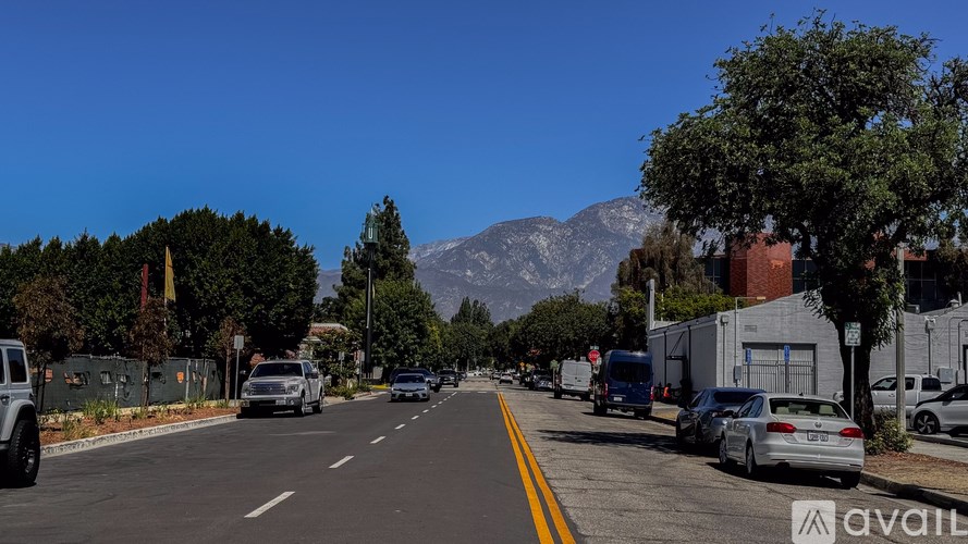 Cars are parked on the side of the street.