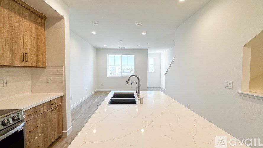 A kitchen with wooden cabinets and a white countertop.