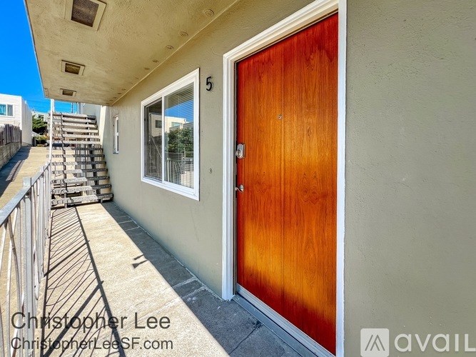 A wooden door with the number 5 on it.