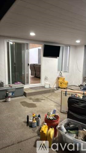 A room with a lot of tools and equipment scattered around.