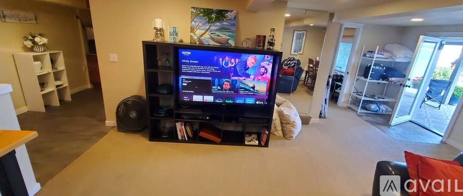 A living room with a television and a speaker.