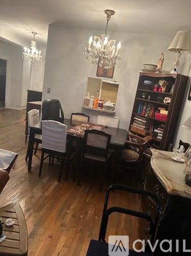 A living room with a dining table and chairs.