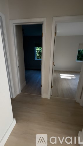 A room with a doorway leading to another room.