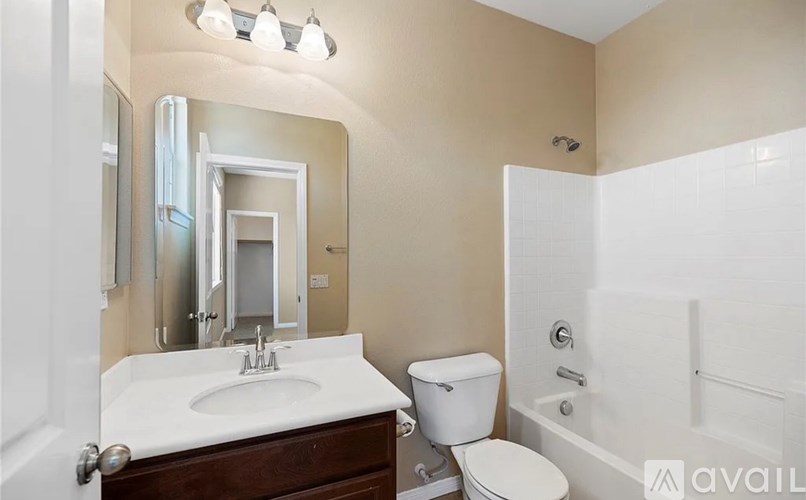 A bathroom with a sink, toilet, and bathtub.