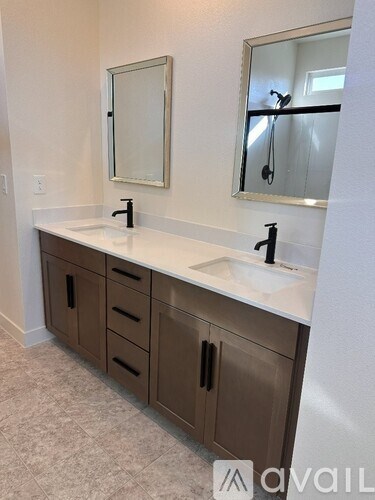 A bathroom with a sink and a mirror.