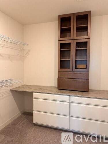A room with a desk and a cabinet.