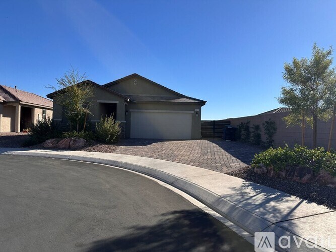A house with a driveway in front of it.