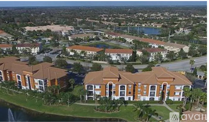 A bird's eye view of a residential area with houses and a body of water.