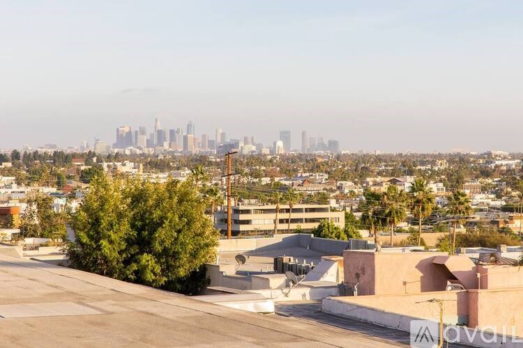 A cityscape with buildings and a clear sky.