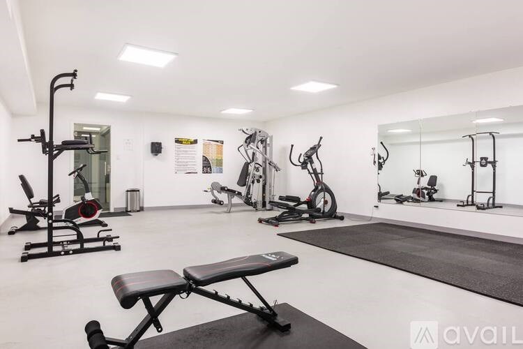 A gym with a variety of equipment including a leg press machine.