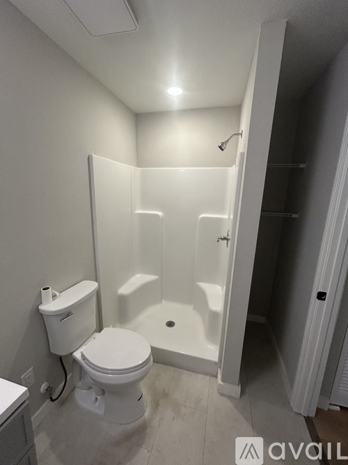 A bathroom with a toilet, sink, and bathtub.