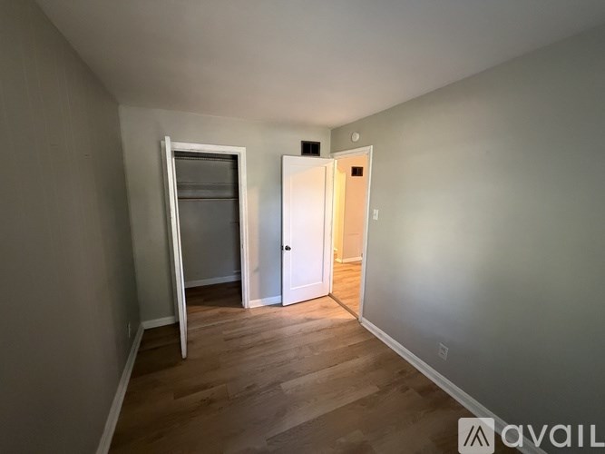 A room with a door and a window.