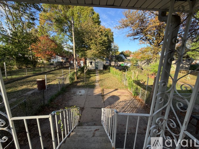 A view from a balcony looking down a path.