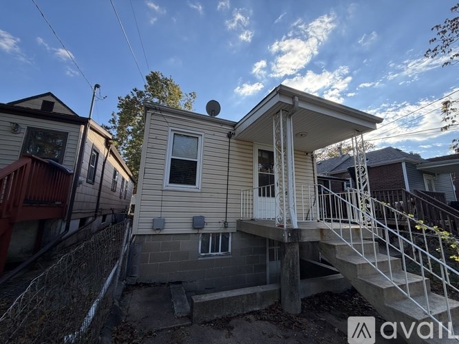 A house with a staircase leading to the second floor.