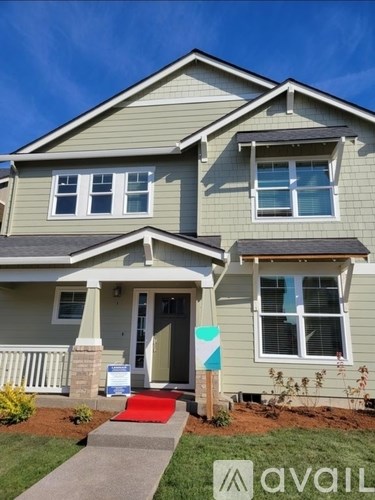 A house with a sign in front of it that says "avail".