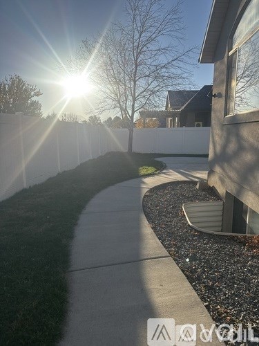A sunny day with the sun shining brightly over a residential area.