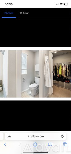 A white bathroom with a toilet and a white door.