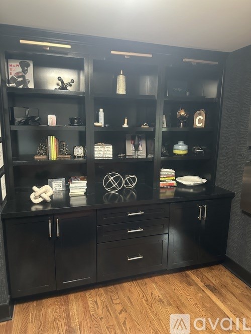 A black shelf with various items on it.