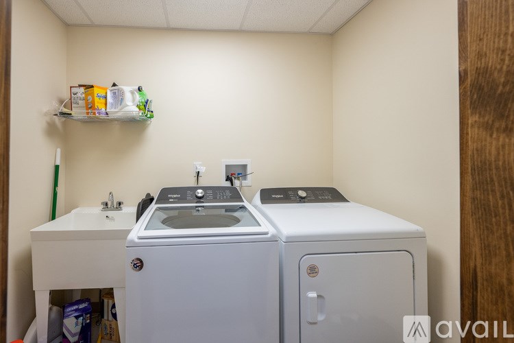 A small laundry room with a washer and dryer.