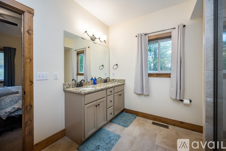 A bathroom with a vanity and a mirror.