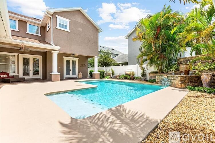 A house with a pool in the backyard.