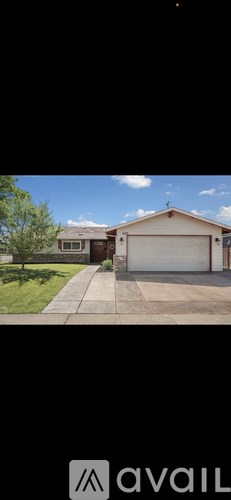 A house with a garage and a driveway.