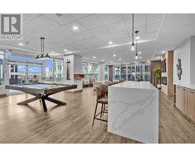 A spacious office with a pool table and a large marble table.